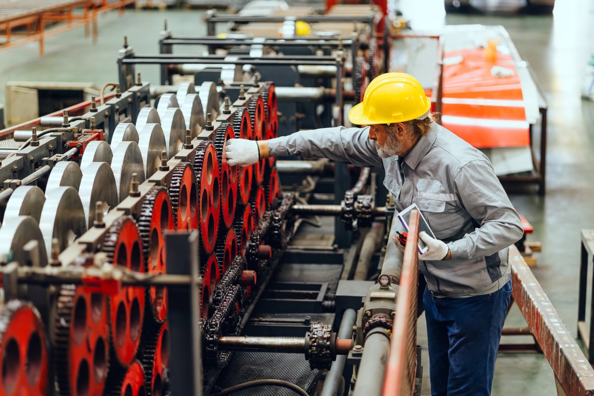 Engineer inspecting industrial machinery