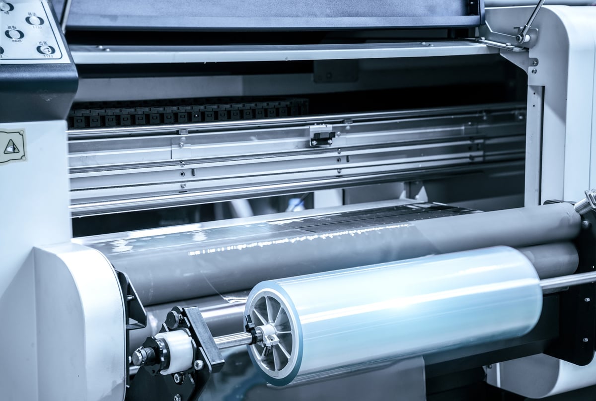 Industrial paper laminating and rewinding machine in factory